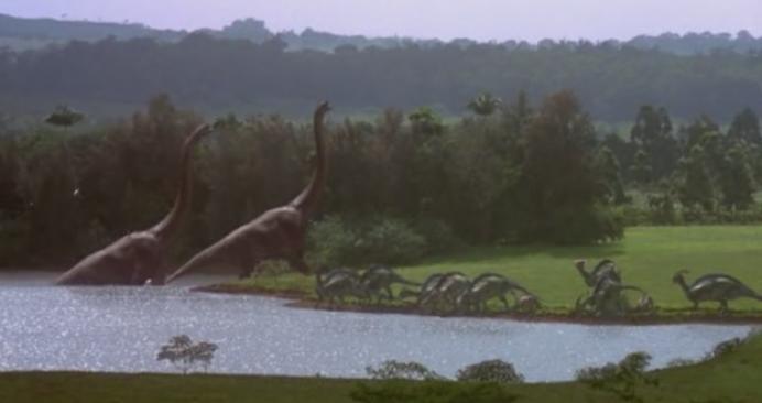 Dinosaurs in a field and lake from Jurassic Park