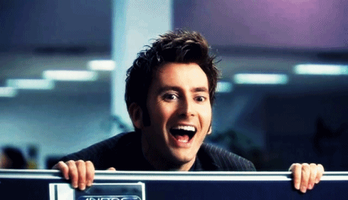 David Tennant as Doctor Who popping up out of a cubicle